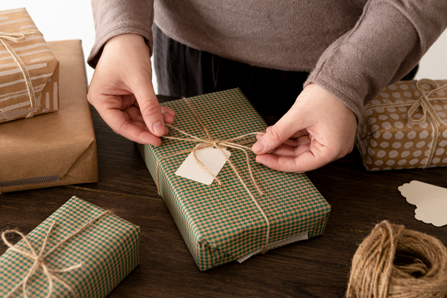 person-wrapping-christmas-gift